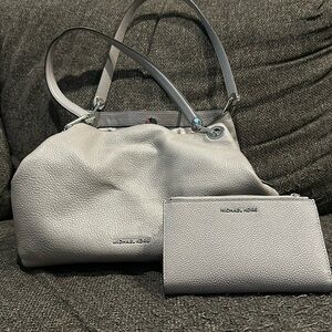 Michael Kors. Large shoulder bag and matching wallet.
